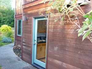 Redwood house with old stain