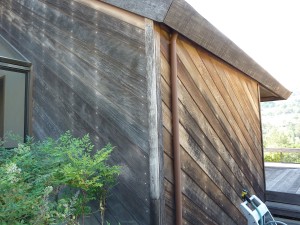 Redwood walls before cleaning and treating