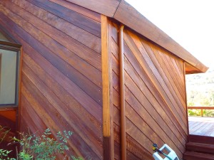 Redwood walls after cleaning and treating