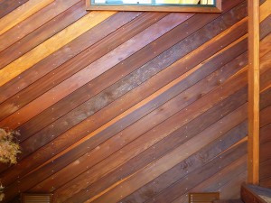 Redwood walls after cleaning and treating